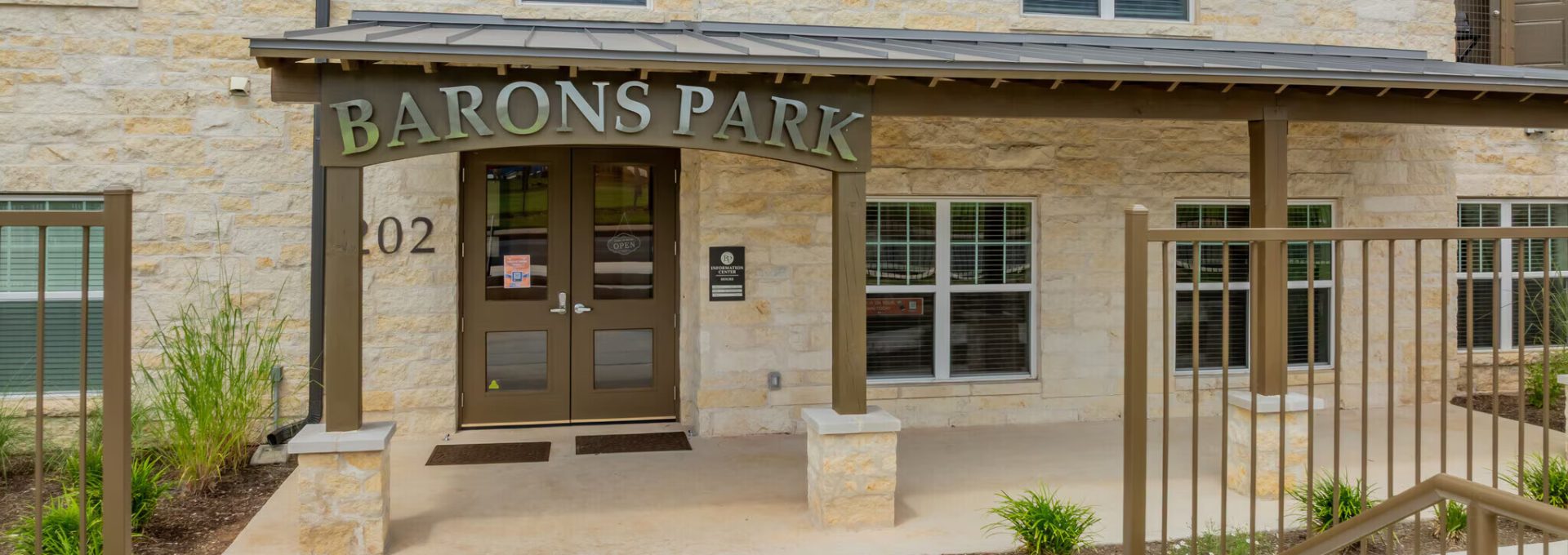 the front entrance to baron park apartments in austin, texas at The Barons Park